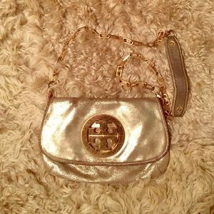 Tory Burch gold clutch with long strap