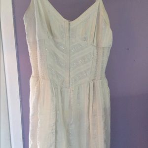 White dress with silver stitching