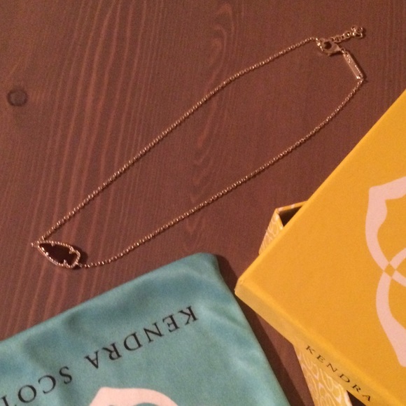 Rare burgundy iridescent stone necklace in gold.