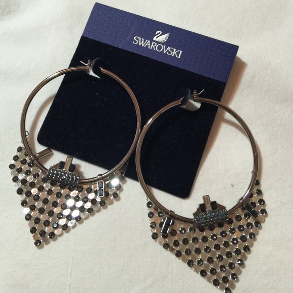 Swarovski hoop earrings with blue crystals.