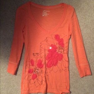 Salmon-colored v neck tshirt from American Eagle