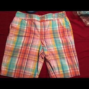 Plaid Bermuda shorts.