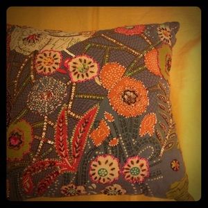 Beautiful decorated green beaded pillow.