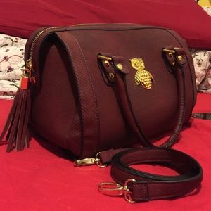 Burgundy bowling bag with gold details