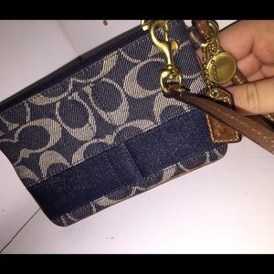 Blue and cream Coach Wristlet