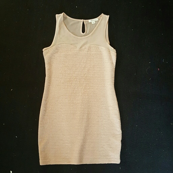 Sleeveless figure flattering cream dress