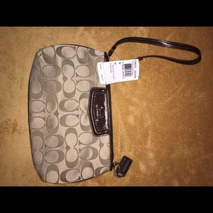 Brand new large coach wristlet purse never used