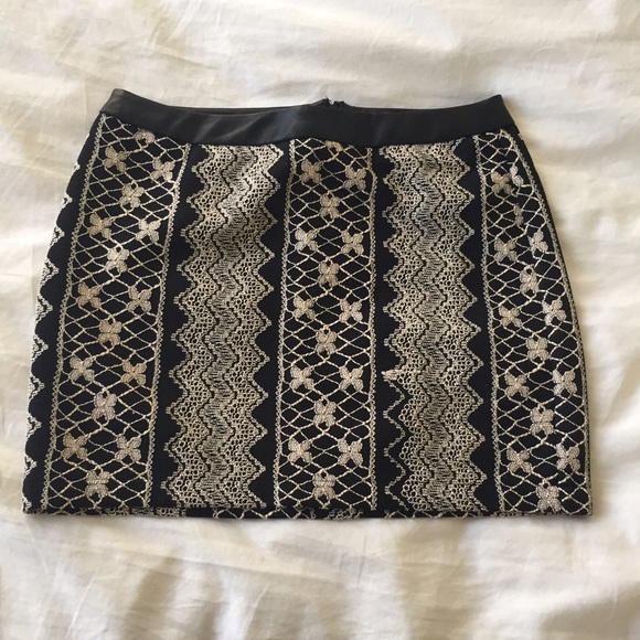 Embroidered mini skirt with faux leather trim