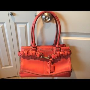 Salmon colored coach bag