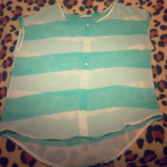 a sheer, teal and white sleeveless shirt.