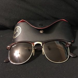 Ray-Ban sunglasses.
