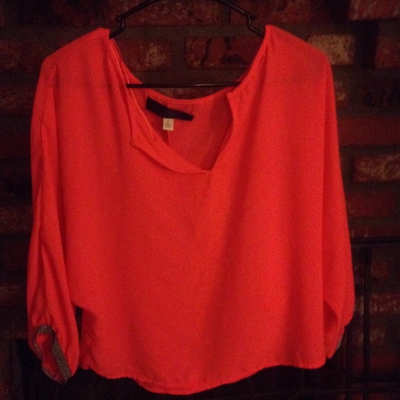 Bright orange flowy blouse