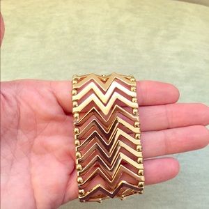 Gold Chevron bracelet.
