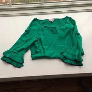Emerald Lilly keyhole sweater with navy trim.