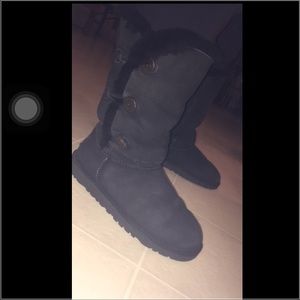 black tall uggs with buttons up both sides