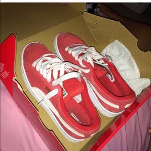 Red suede Puma sneakers