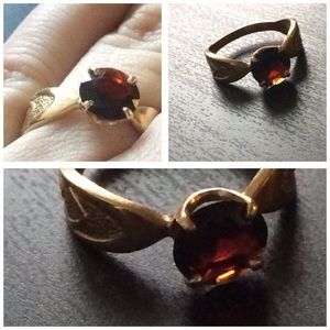 Antique gold ring with glistening garnet