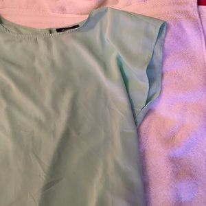 Mint green tshirt! With buttons down the back