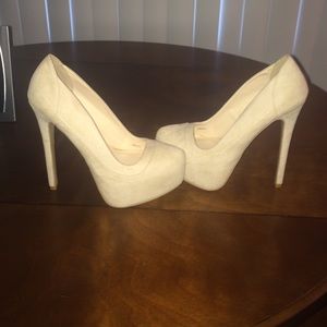 Never been worn. Tan suede stiletto pumps.