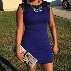 Royal blue dress with vegan leather shoulders.