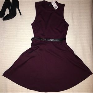 Eggplant/plum short flare dress with black belt.