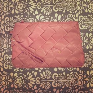 Pink faux leather ruffle clutch