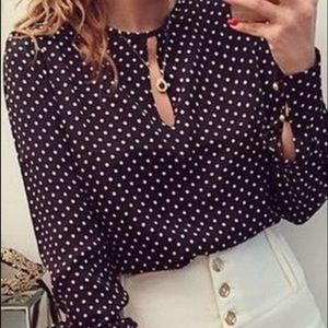 Navy polka-dotted blouse