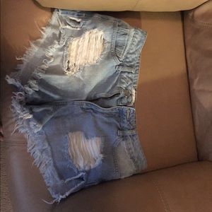 Ripped blue jean shorts
