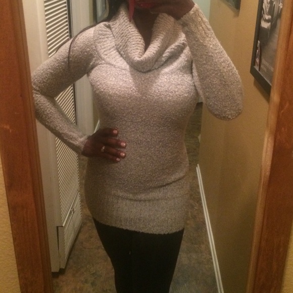 Grey and white turtle neck sweater.