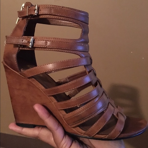 A tan, wedged heel strap sandal!