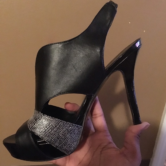 A sexy, black, peep toe, open back high heel