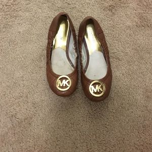 Michael Kors brown leather flats.