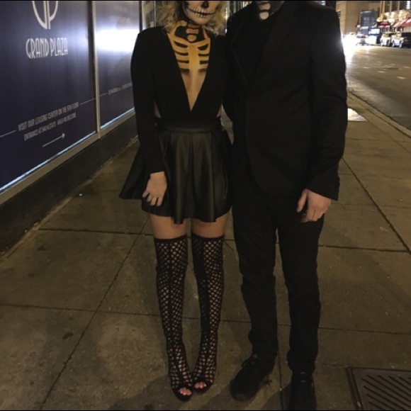 Black thigh high boots.