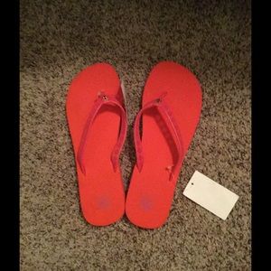 Tory Burch flip flops pink and orange.