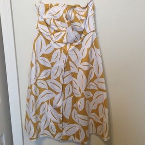 Strapless dress, mustard yellow with white leaves