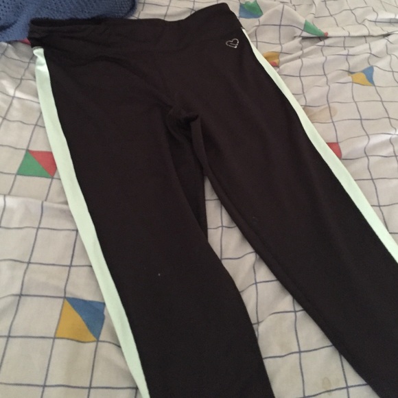 Greenish and black yoga pants (leggings)