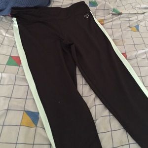 Greenish and black yoga pants (leggings)