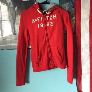 Red Abercrombie and Fitch zip up.