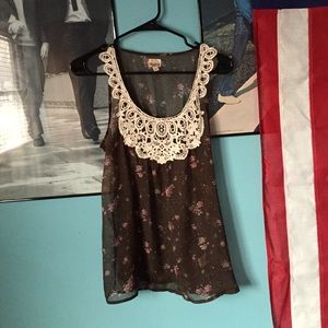 Brown top with pink roses all over.