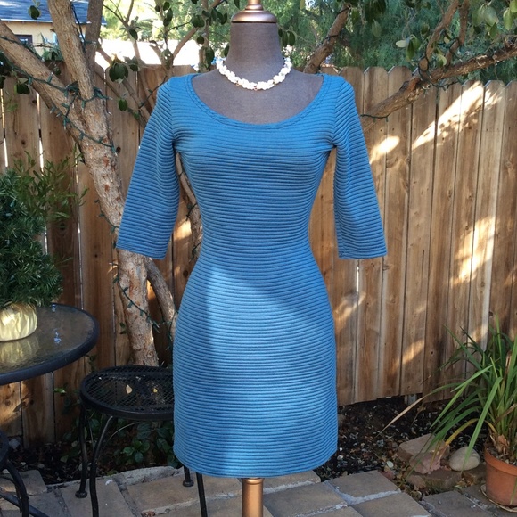 Teal fitted 3/4 sleeve dress.