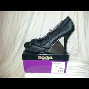 Black satin heels with lace trim and satin bow.
