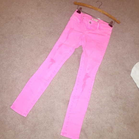 Coral skinny jeans with ripped cutouts