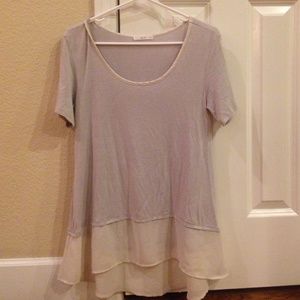 This is a cute, flowy, short sleeve shirt!