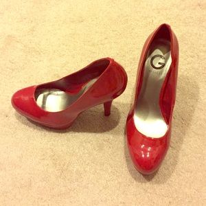 Glossy red pumps