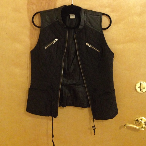 Black and gold vest