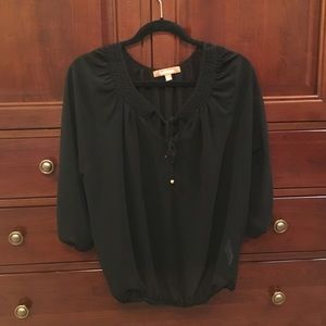 Translucent black top with adjustable neckline