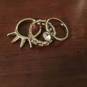 Three gold rings in assorted sizes