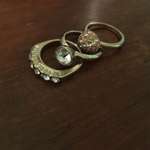 Three gold rings in assorted sizes