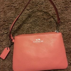 Coach peach pink wristlet