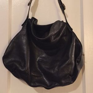 BCBG bucket bag in black.